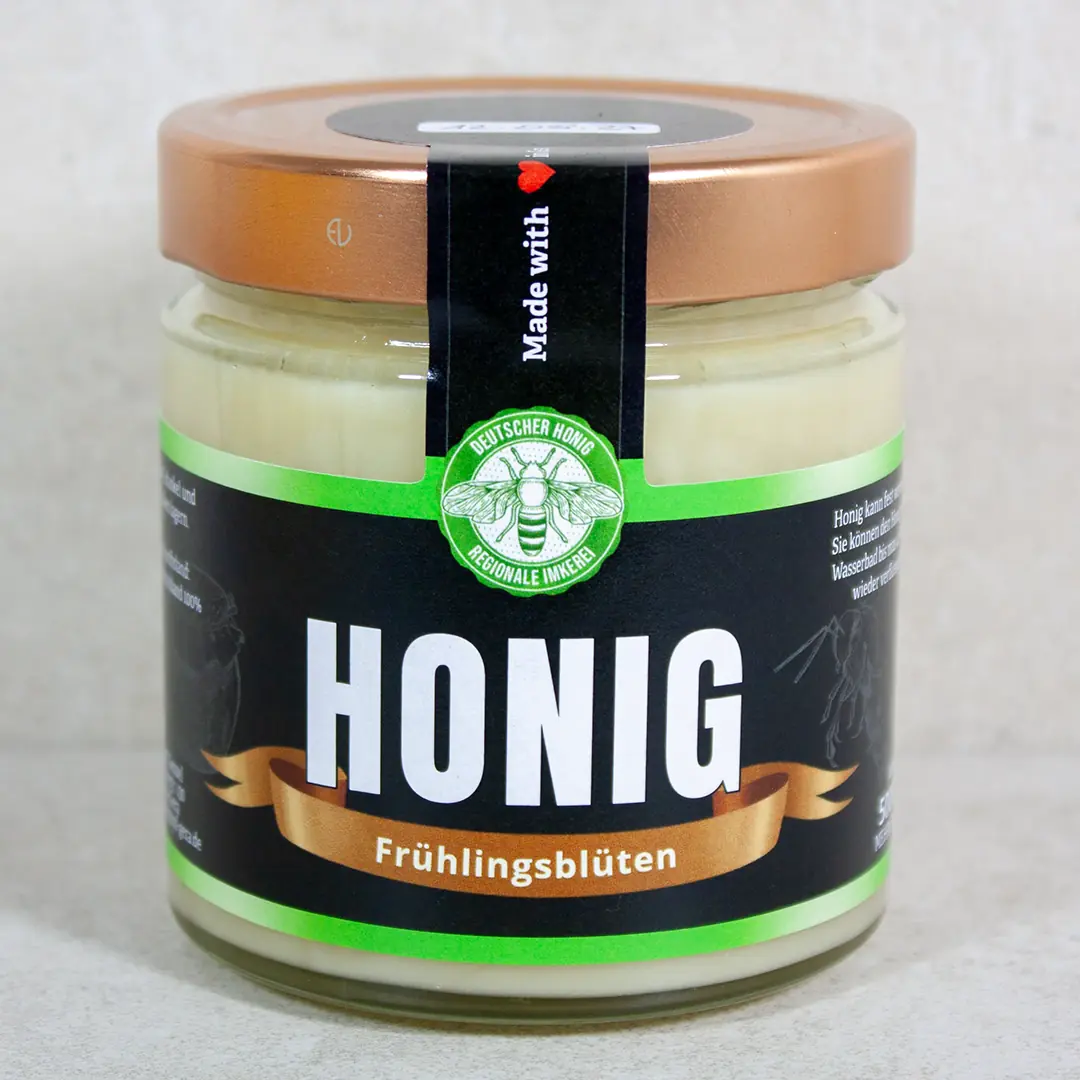 Glas mit hellgelbem, cremigem Frühtrachthonig vom Imker aus Gera